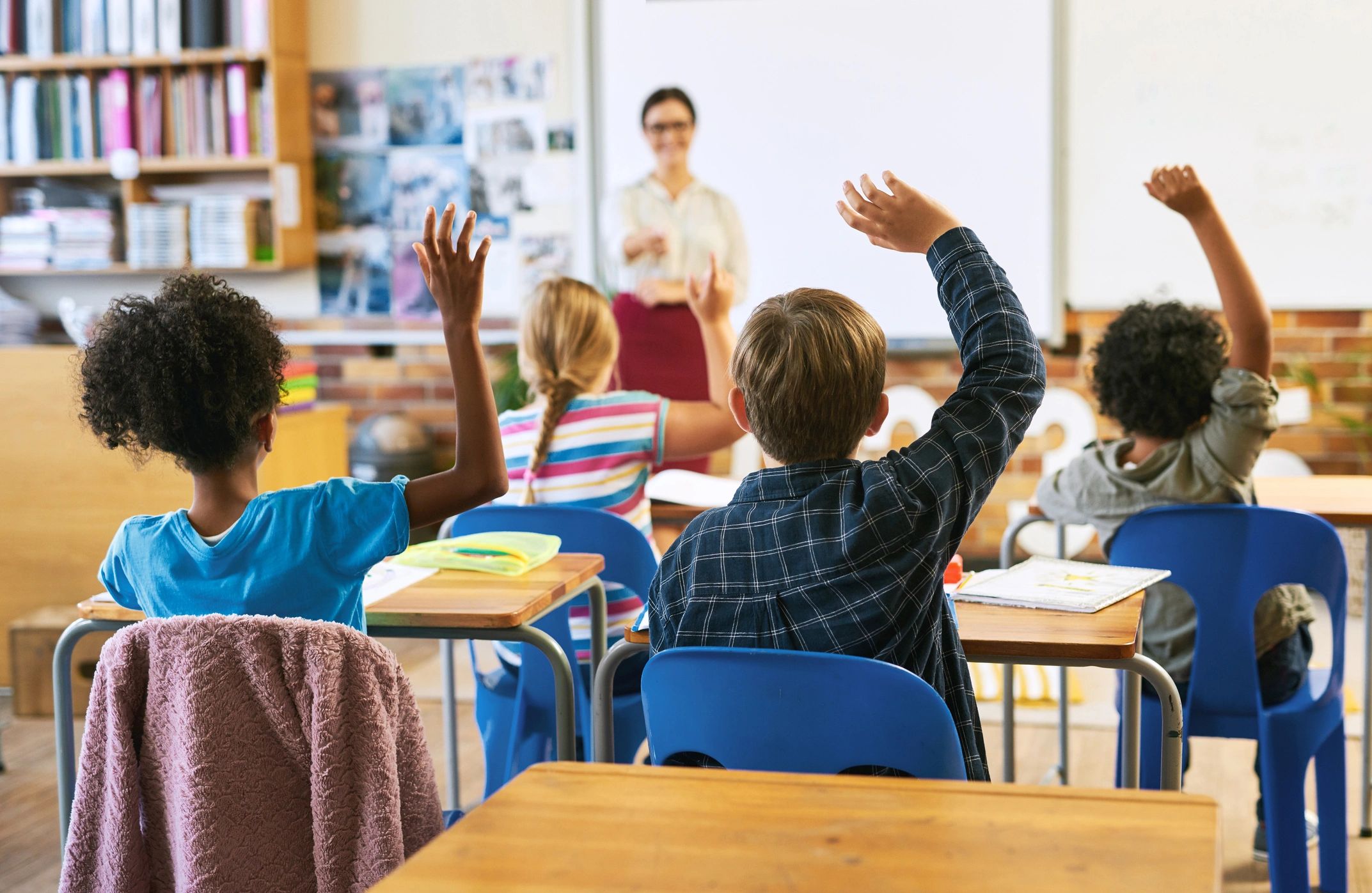 teacher with students classroom multicultural