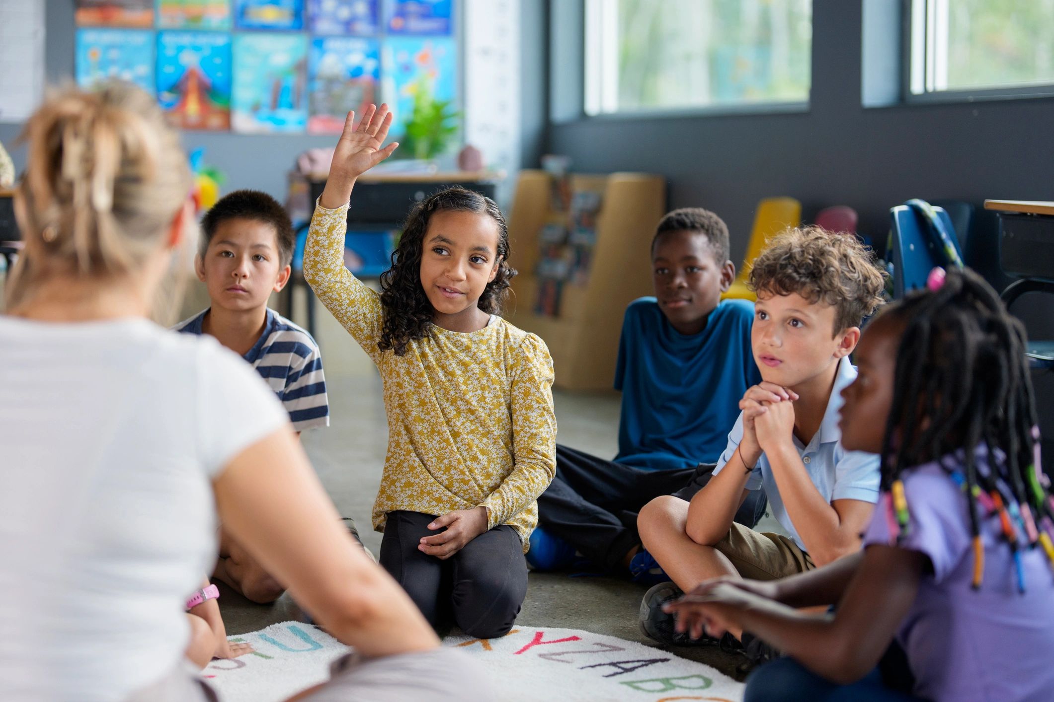 teacher with students classroom multicultural