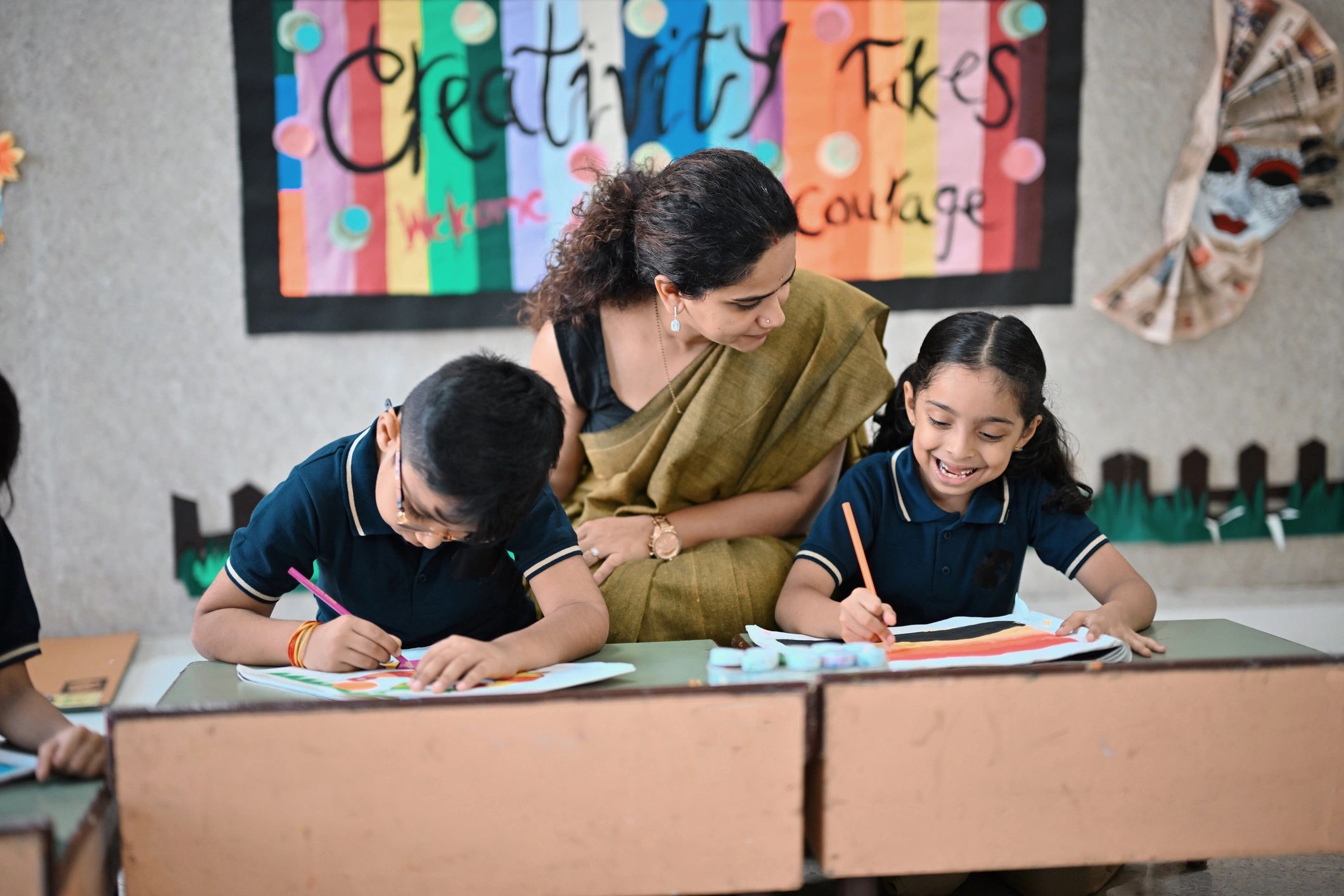 Teacher helping student art