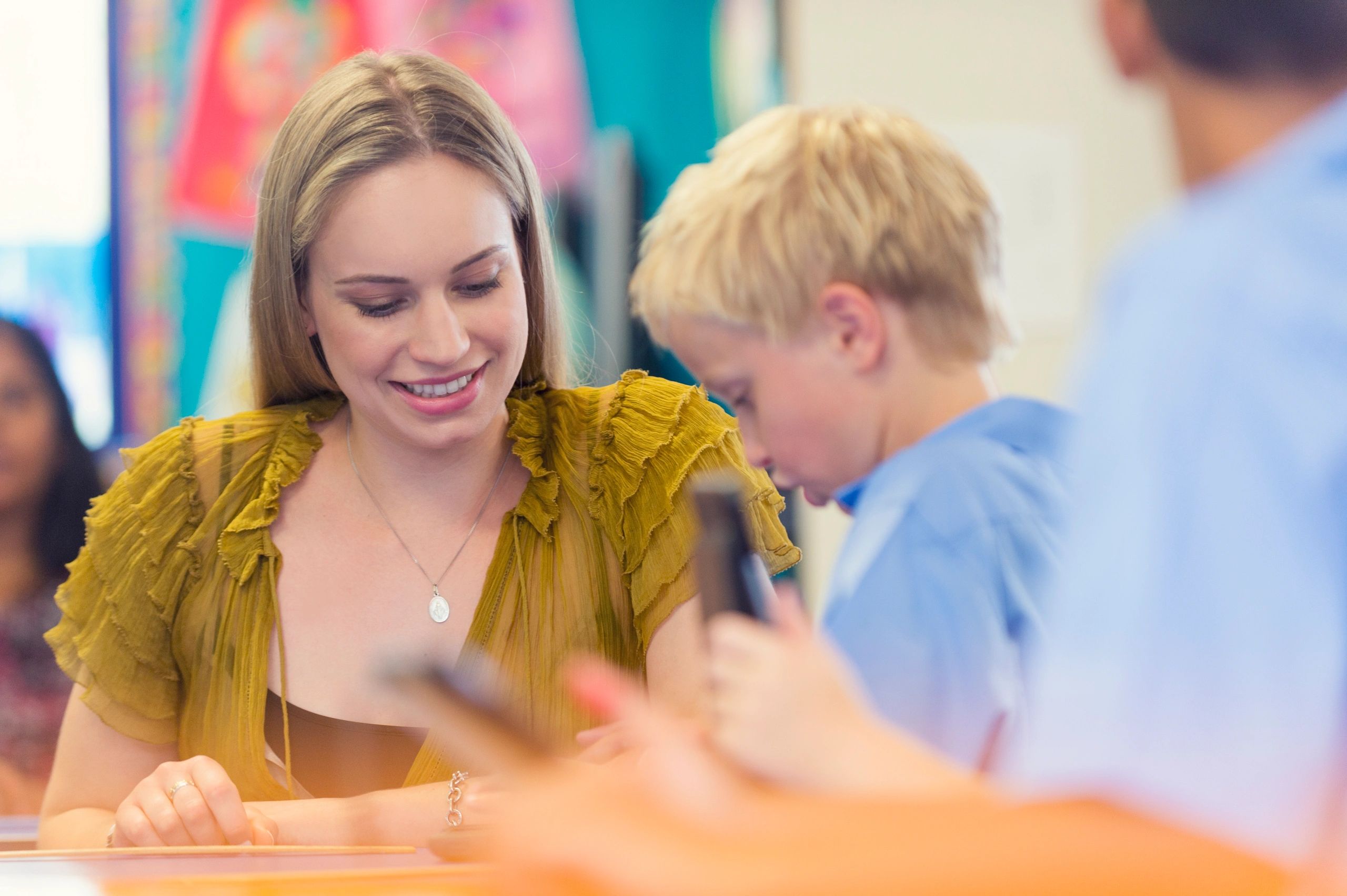 teacher helping students multicultural